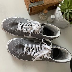 Grey high top Vans.